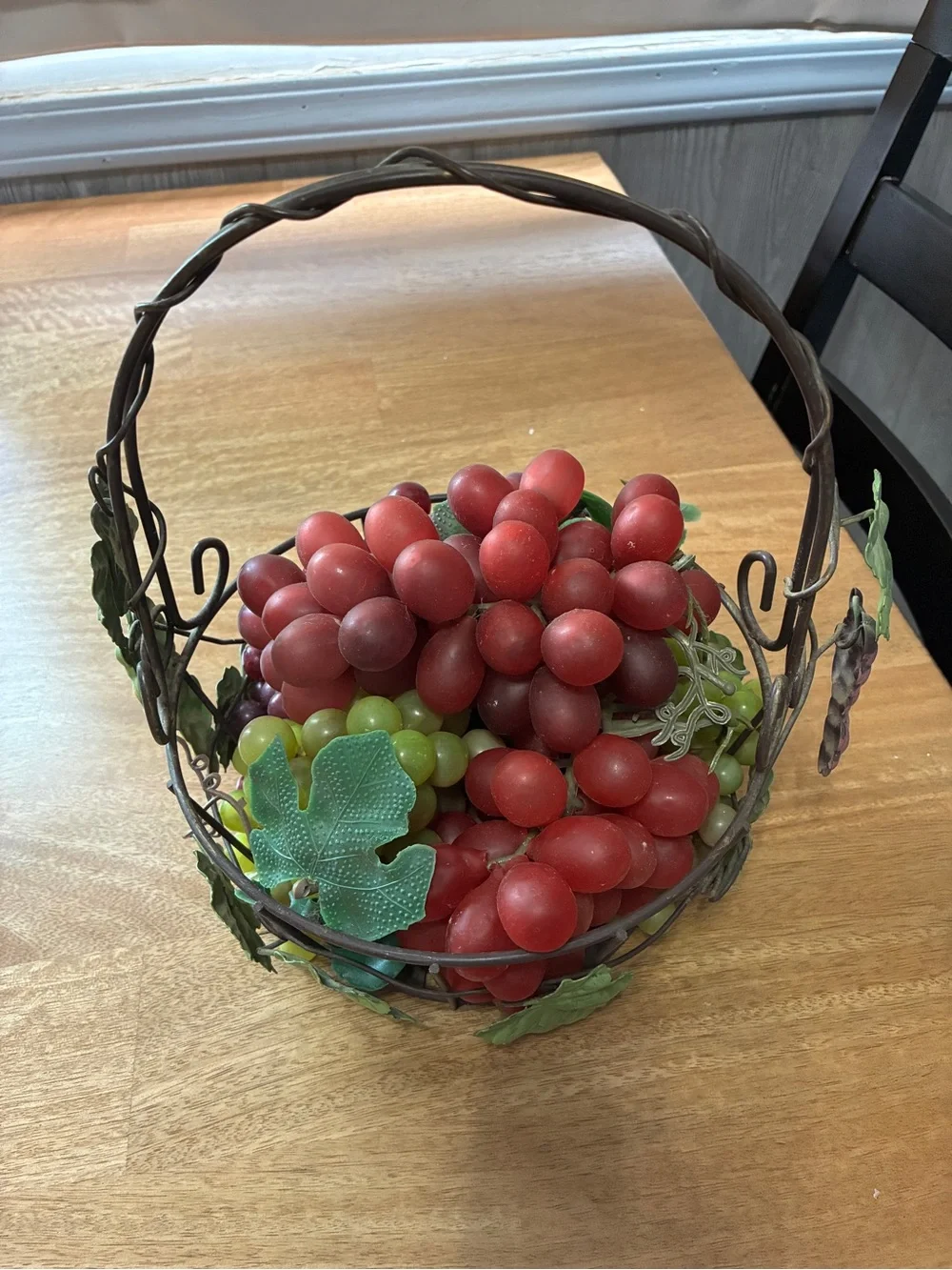 decorative artificial grape clusters, in a wire basket 8” x 10”
